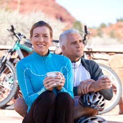 couple drinking coffee on bike ride