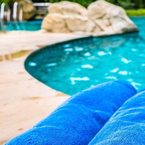 towels next to a pool