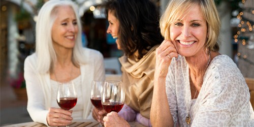 friends enjoying drinks on restaurant patio