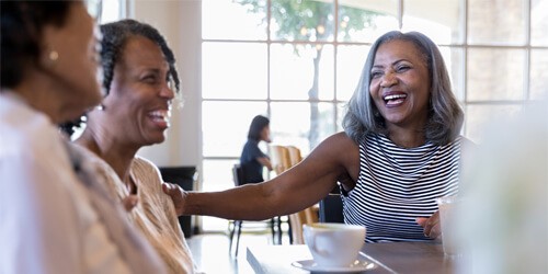 friends laughing in a restaurant